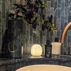 Cove rechargeable alabaster lamp showing natural stone veining and translucency