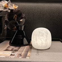 Cove Spanish alabaster cordless lamp illuminated and touch dimmed