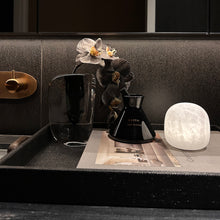 Cove cordless alabaster stone table lamp styled in a contemporary interior