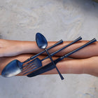 Close up of matte black titanium plated stainless steel cutlery