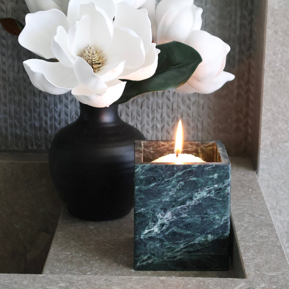 Verde Alpi marble square vessel used as candle holder using candle sand