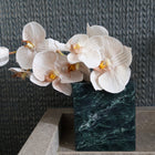 Verde Alpi marble vessel styled on bathroom vanity as marble flower vase