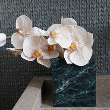 Verde Alpi marble vessel styled on bathroom vanity as marble flower vase