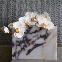 Calacatta Viola marble vessel styled as a flower vase on shelf as sculptural home object 
