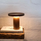 Walnut timber portable table lamp with warm ambient glow by Lokah & Co