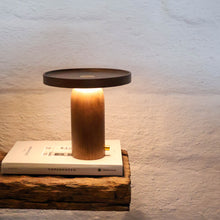 Walnut timber portable table lamp with warm ambient glow by Lokah & Co