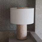 Portable travertine lamp with dimmable warm light for modern interiors