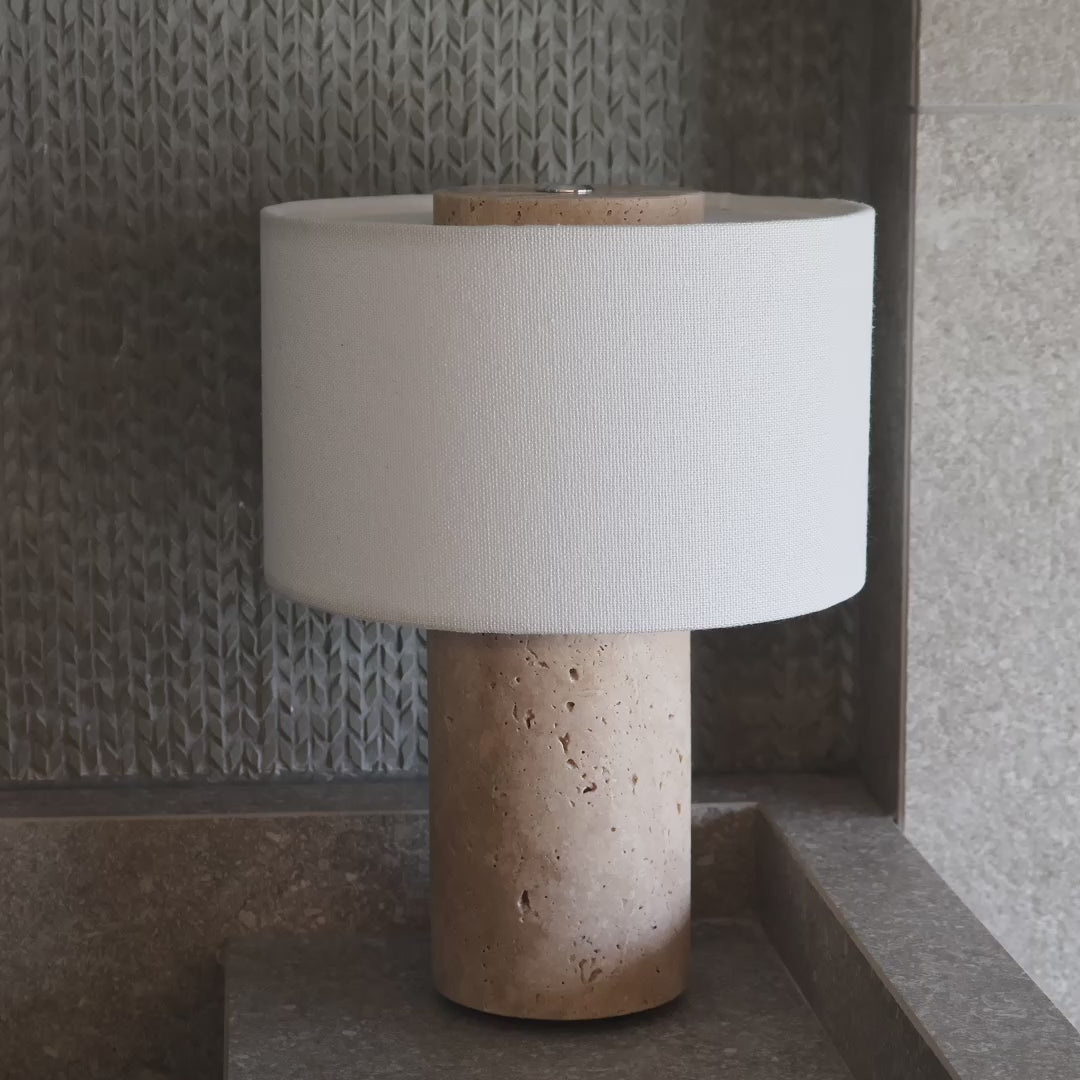 Portable travertine lamp with dimmable warm light for modern interiors