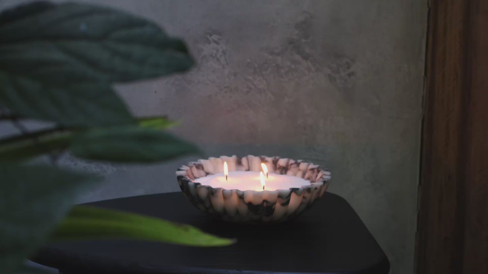Calacatta Viola marble scalloped bowl sculptural marble bowl emitting ambient candle glow using candle sand